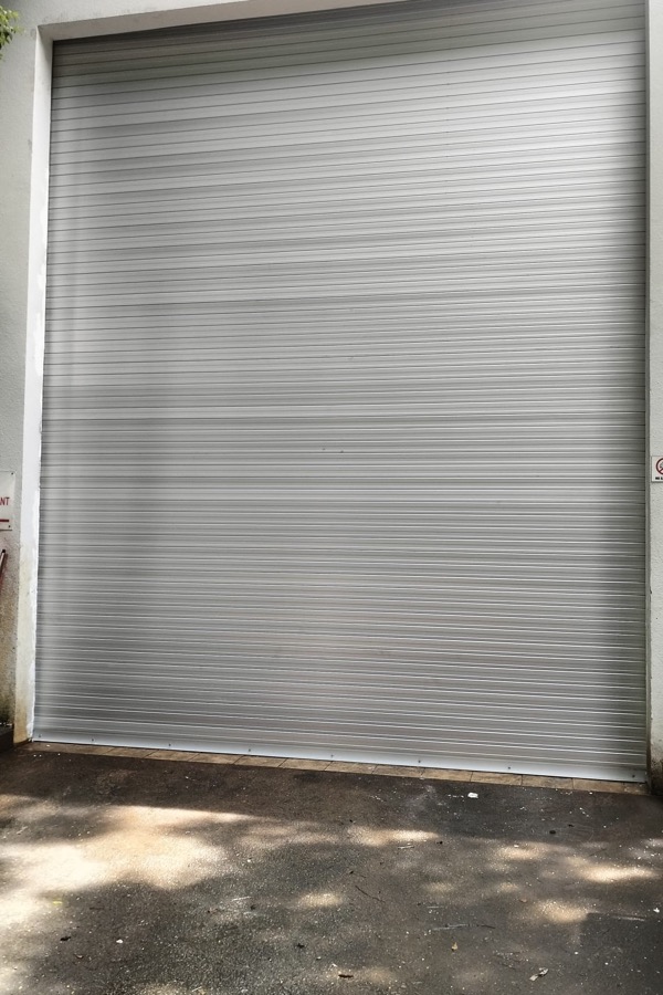 Large motorised roller shutter at an industrial entrance