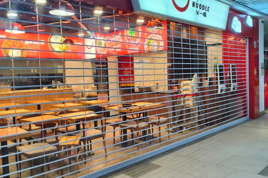 Commercial roller grille shutter requiring service support