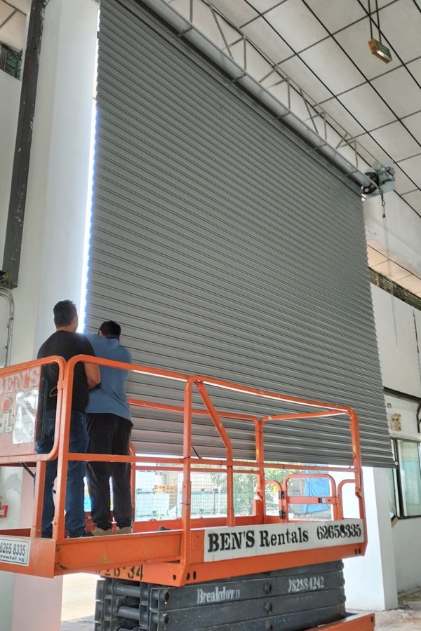 Roller shutter technicians carrying out on-site repair work